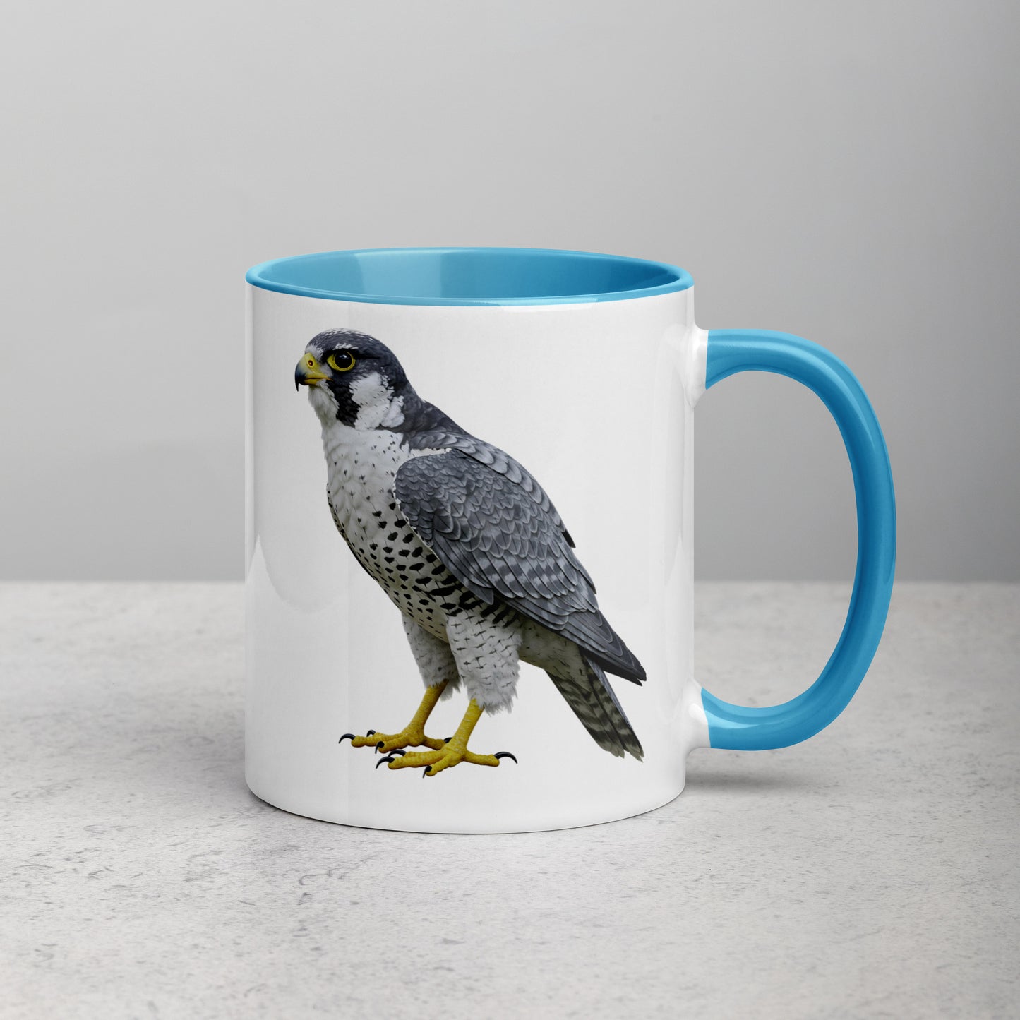 peregrine falcon portrait design on a white coffee mug with blue handle