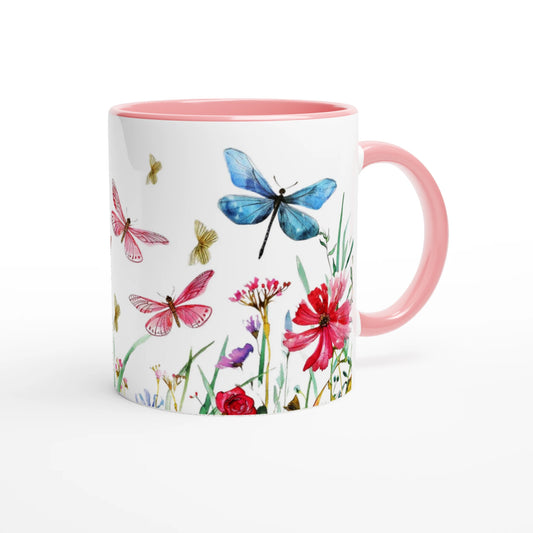 dragonflies and wild flowers design on a white coffee mug with pink handle