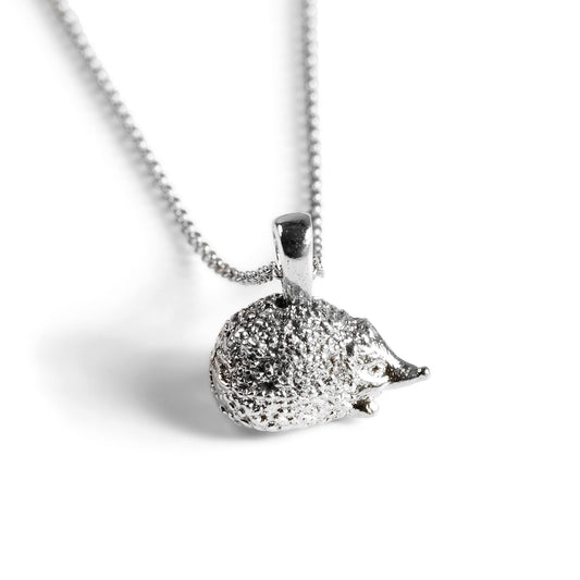 Silver hedgehog pendant necklace on a chain against a white background