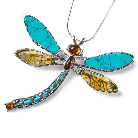 dragonfly neacklace in silver turquoise and amber on a white background