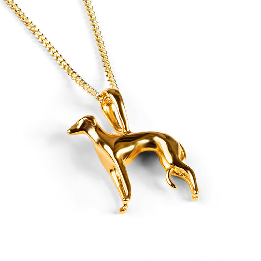 greyhound necklace in gold with a gold chain on a white background