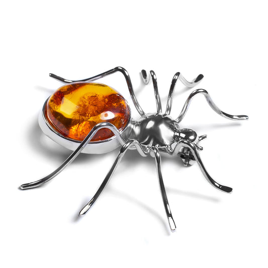 spider design brooch  made of silver and Baltic amber