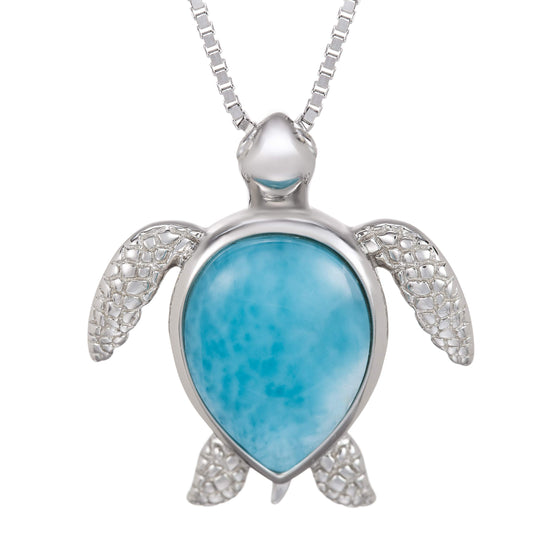 turtle necklace pendant with turquoise stone and silver detailing on a white background