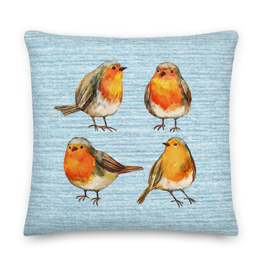 Decorative pillow with four illustrated red breasted robins on a light blue background