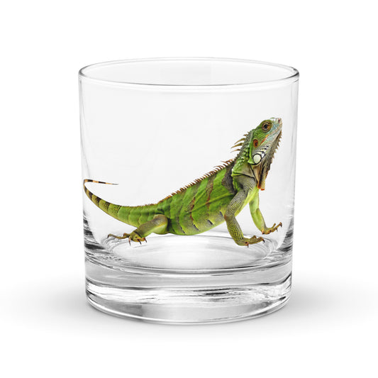 green iguana on a glass whickey tumbler