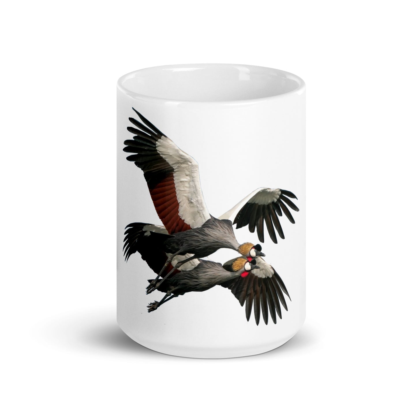 White glossy mug printed with a pair of crowned cranes in flight